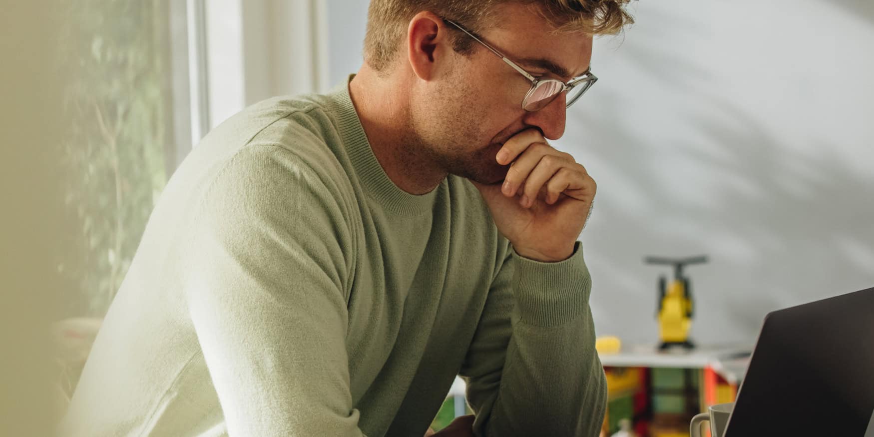 A man concentrating at a laptop