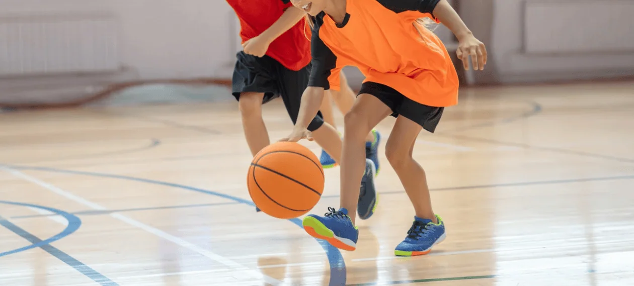 Kids basketball game indoor dribble action