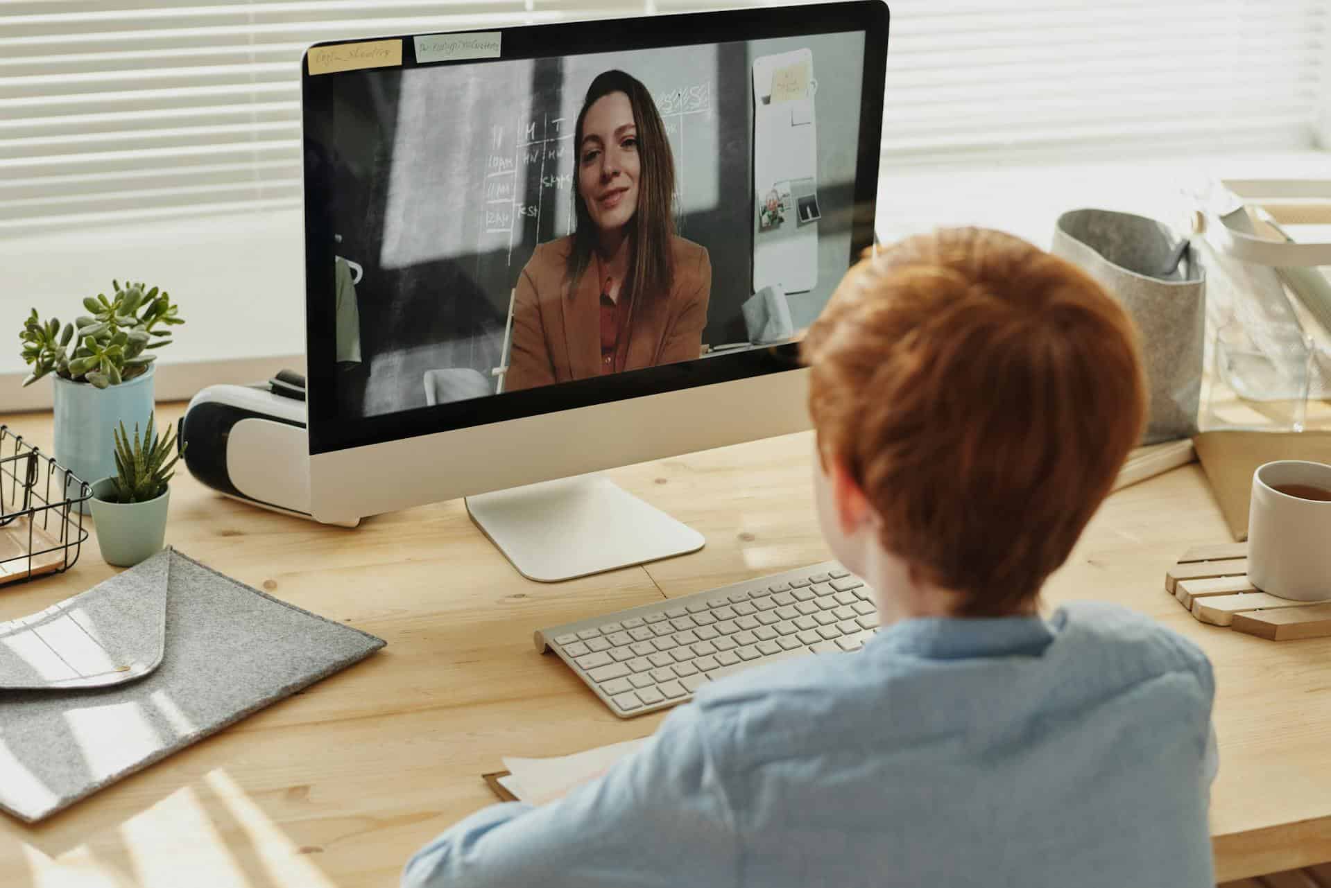 Child attending an online session with a therapist on a computer, representing how Strategic Hypnotherapy can support ADHD friendly routines.