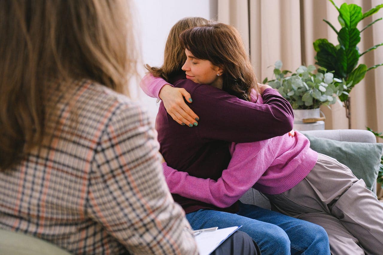 One person comforting another