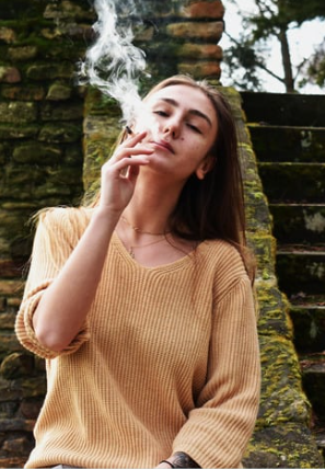 Woman smoking stairs